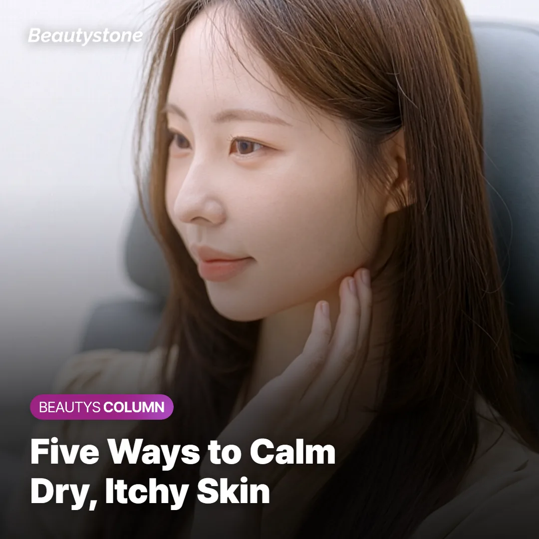 Hands applying a thick moisturizing cream to dry skin right after a shower