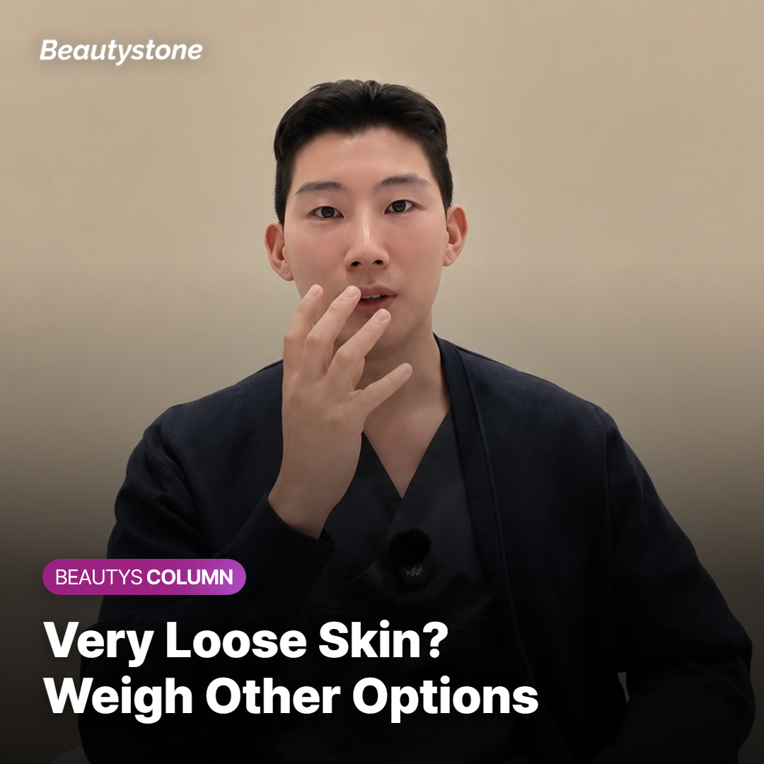 Doctor gently assessing loose skin along the jaw before deciding on a plan