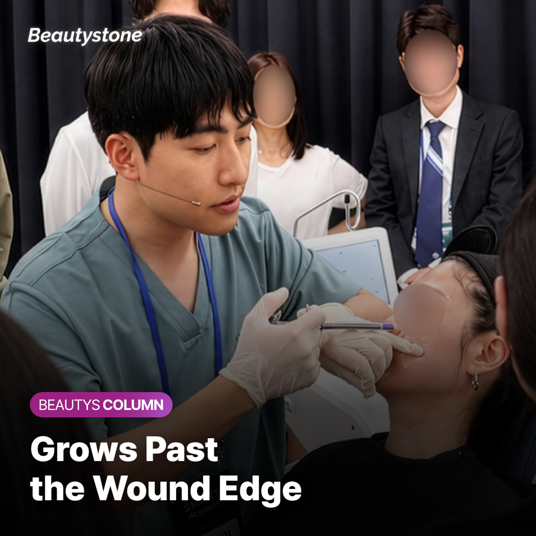 A doctor gently pressing a raised keloid scar on a patient's upper chest to check how firm it is